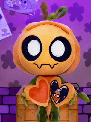Gourdy Dandys World plush doll, cute orange pumpkin stuffed toy with heart detail sitting on wooden crate display