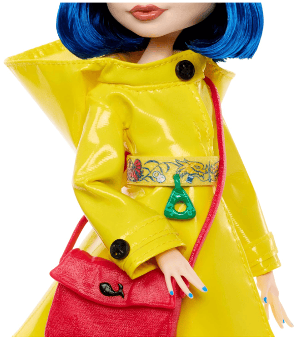 Monster High Skullector Doll, Coraline Collectible in Yellow Raincoat with Dress and Accessories Like Rag Doll, Cat Figure, and Doll Stand
